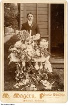 High school graduate Byron Boyd with flowers, Mitchell, Indiana, circa 1898
