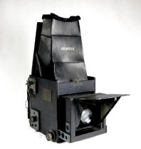 Front view with lens and reflex viewer open