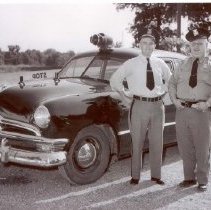 Chief Elmer Pete Peters and Sgt. William Brown of the Orchard Lake police Department.