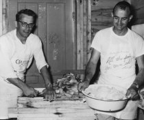 Unknown person with Gene Schultz at the fish fry