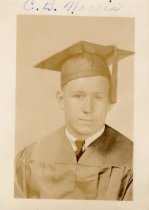 Photo of C.B. Norris in his graduation cap and gown