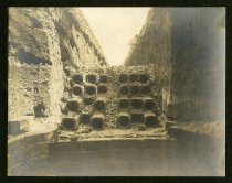 Sepia-toned photo showing underground electrical duct banks that are to be mortared in place