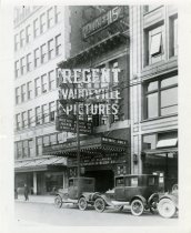 Black and white photo of the exterior of the Regent Vaudeville and Pictures theater as taken from the west side of Woodward Avenue, facing northeast