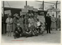 Sepia-toned photo of a group of people aboard the German ocean liner ST