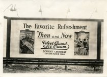 Black and white photographic print depicting a Walker & Co. billboard displaying an advertisement for Velvet Brand Ice Cream