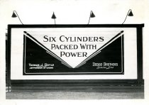Black and white photographic print depicting a Walker & Co