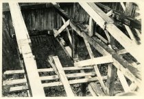 Digital scan of a sepia-toned photo taken of the inside of an excavation dug for the construction of the Detroit-Windsor Tunnel