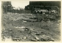Digital scan of a sepia-toned photo of the ground beneath Randolph Street, south of Franklin Street during the excavation that occurred for the construction of the Detroit-Windsor Tunnel