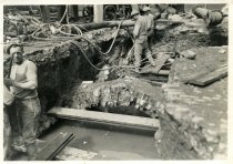 Digital scan of a sepia-toned photo of construction beneath Randolph Street for the Detroit-Windsor Tunnel