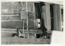 Digital scan of a sepia-toned photo of some of the wiring put in place to supply lighting underground for the construction of the Detroit-Windsor Tunnel, as taken from overhead