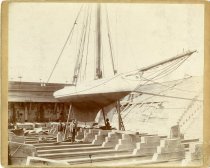Mounted sepia-toned photograph of the sail yacht CZARINA in drydock as taken from below its starboard bow