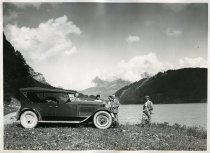 Black and white photographic print of a right side view of a Packard 8 convertible, with the top up, taken near the Swiss Alps