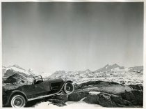 Black and white photographic print of a right side view of a Packard 8 convertible taken in the Swiss Alps