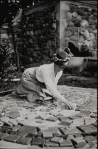 Miss Perry at work with her tiles