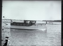 Monochromatic glass-plate negative taken of the starboard side of a cabin crusier