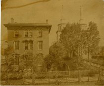 Black & white photographic print depicting Ste. Anne de Detroit Catholic Church and rectory