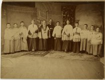 Black & white photographic print depicting acolytes (altar servers) at Ste. Anne de Detroit Catholic Church