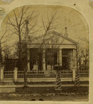 Sepia-toned photograph cut from a the right half of a stereographic card, despicting the exterior of the E. C. Walker residence on Griswold Street