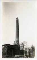 One sepia-toned photograph of the newly-constructed smokestack at the Herman Kiefer Hospital power house