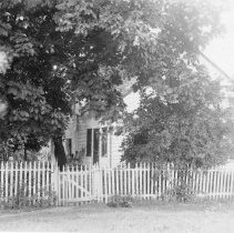 [Farmhouse with picket fence]
