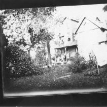 [Woman and child on the porch of Silvester House]