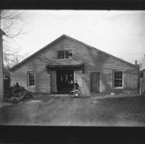 [Garage with man and bicycle]