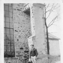 [Men by Stone Building]