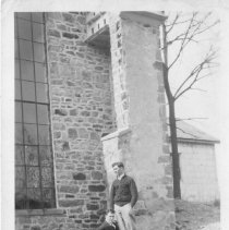 [Men by Stone Building]