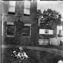 [Little Girl with Puppies]