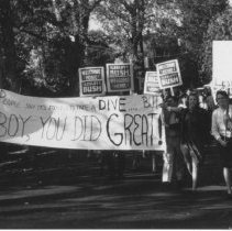 [Residents with signs in Lesley Bush parade]