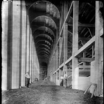 [Men inside Palmer Stadium during construction]