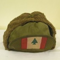Green flap hat with Lebanese flag painted on upturned brim
