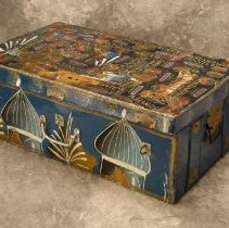 Blue metal trunk painted with domed towers and