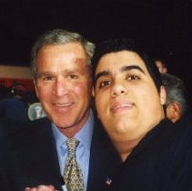 Color photo of Nicola meeting President George W Bush in a crowd