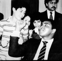 Black & white image of Tarick Salmaci as young child with Mohamad Al