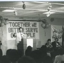 Black & white photo of Reverend Jesse Jackson addressing a crowd
