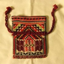 Tatreeze purse in red, burgundy, black and lime green