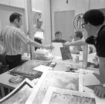 Black & white photo of El-Baz and colleague showing crew charts of the moon