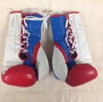 Back of red, white and blue boxing gloves with laces