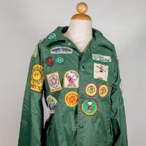 Green Girl Scout jacket with patches