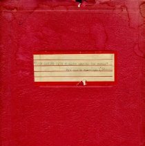 Red manuscript cover with typed label
