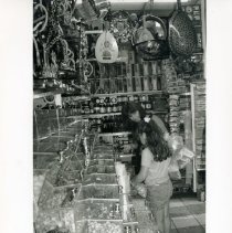 Black & white photo of mom and daugther in shop with bulk bins