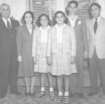 1946-family black and white image of 6-person family in a living room