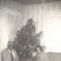 1950-01 black & white photo of man and woman by a Christmas tree