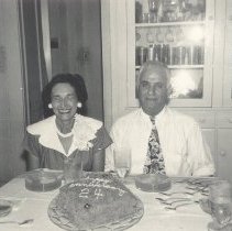 1951-anniv black and white photo of couple with anniversary cake