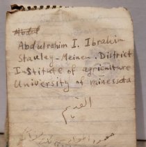 Small notebook page with English and Arabic