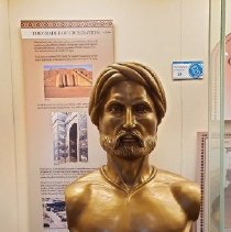 Bronze bust of bearded man in exhibit case