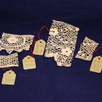 Fragments of lace with hang tags attached