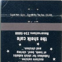 Black and white matchbook cover with image of buildings