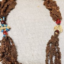 Detail of necklace red stone pendant